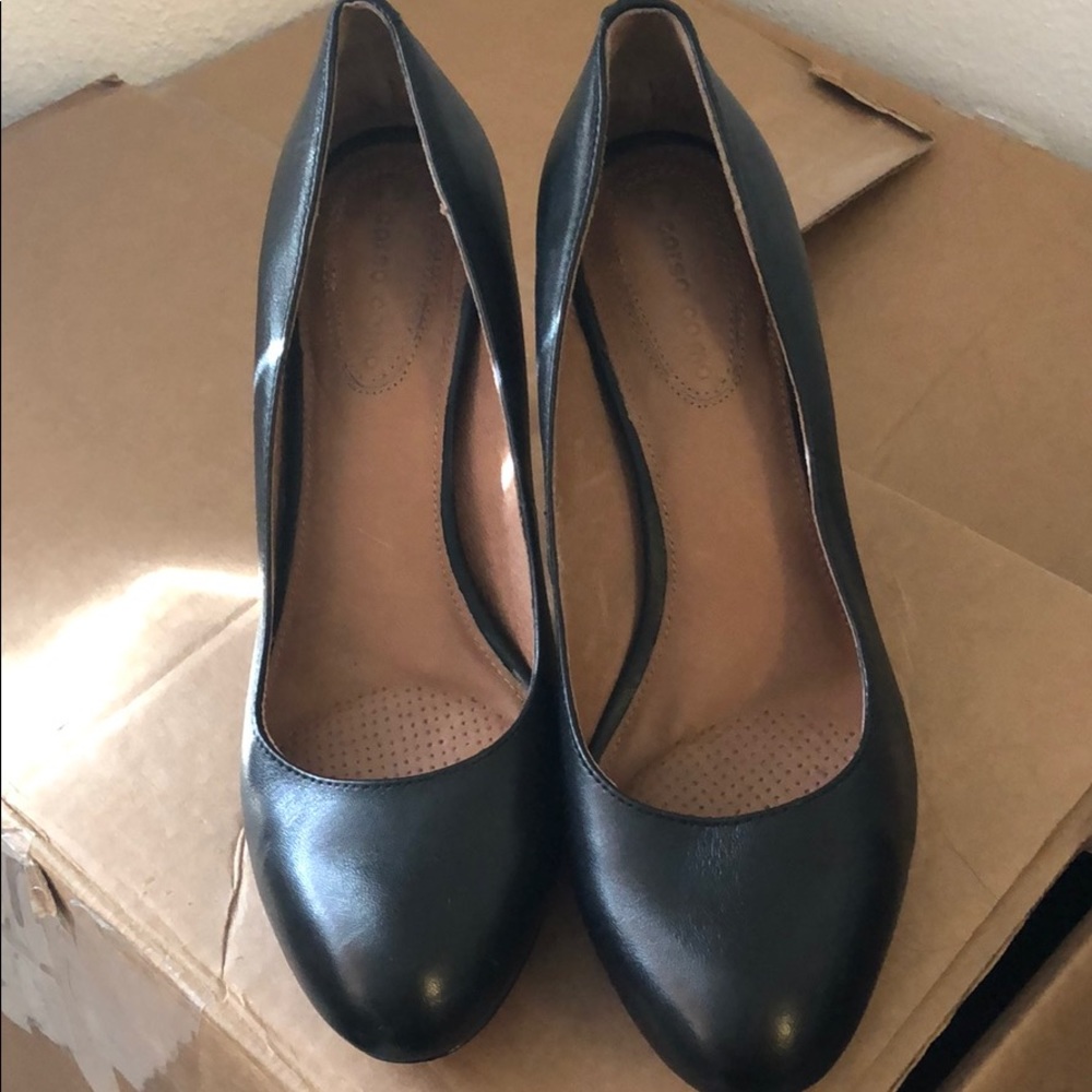 Black leather pumps